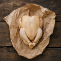 Whole pasture-raised chicken on butcher paper